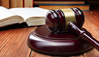 Judge gavel on a wood desk